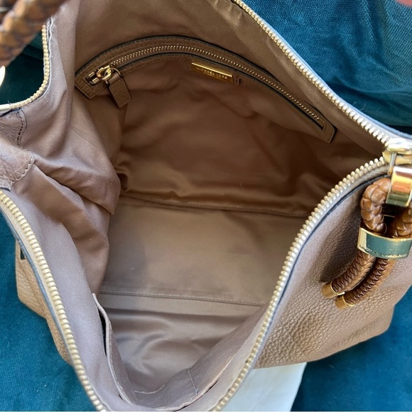 MICHAEL KORS COLLECTION
Skorpios Desert Tan Pebbled Leather Hobo
Bag $79… - Picture 11 of 16